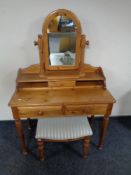 A contemporary pine mirror back dressing table with stool