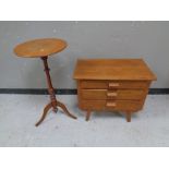 A 20th century teak three drawer chest together with a tripod table
