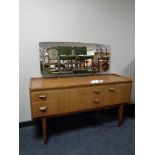 A mid 20th century teak mirror back dressing table