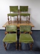 An early 20th century continental pull out dining table on bulbous legs together with a set of six