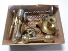 A box containing a pair of brass wall lights, pair of brass candlesticks,