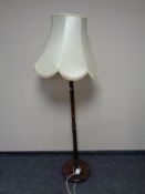 A turned beech standard lamp