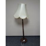 A turned beech standard lamp