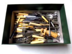 A box containing a large quantity of loose stainless steel and silver plated cutlery