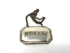 A silver plated decanter label - whisky