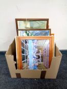 A box containing assorted pictures and prints,