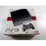 A Sony PS3 in box with one controller