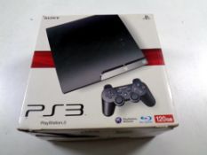 A Sony PS3 in box with one controller