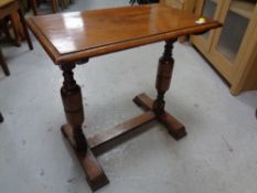 An Edwardian oak occasional table