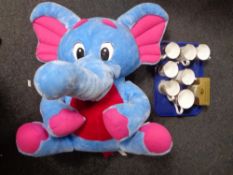 A tray containing Ringtons and other commemorative mugs together with an elephant soft toy and a