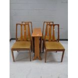 A 20th century teak drop leaf dining table together with a set of four chairs in beige upholstery