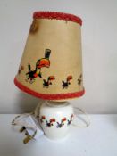 A Guinness table lamp and shade decorated with toucans