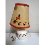 A Guinness table lamp and shade decorated with toucans