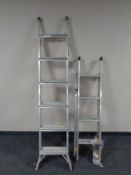 An aluminium folding ladder together with a similar extension ladder