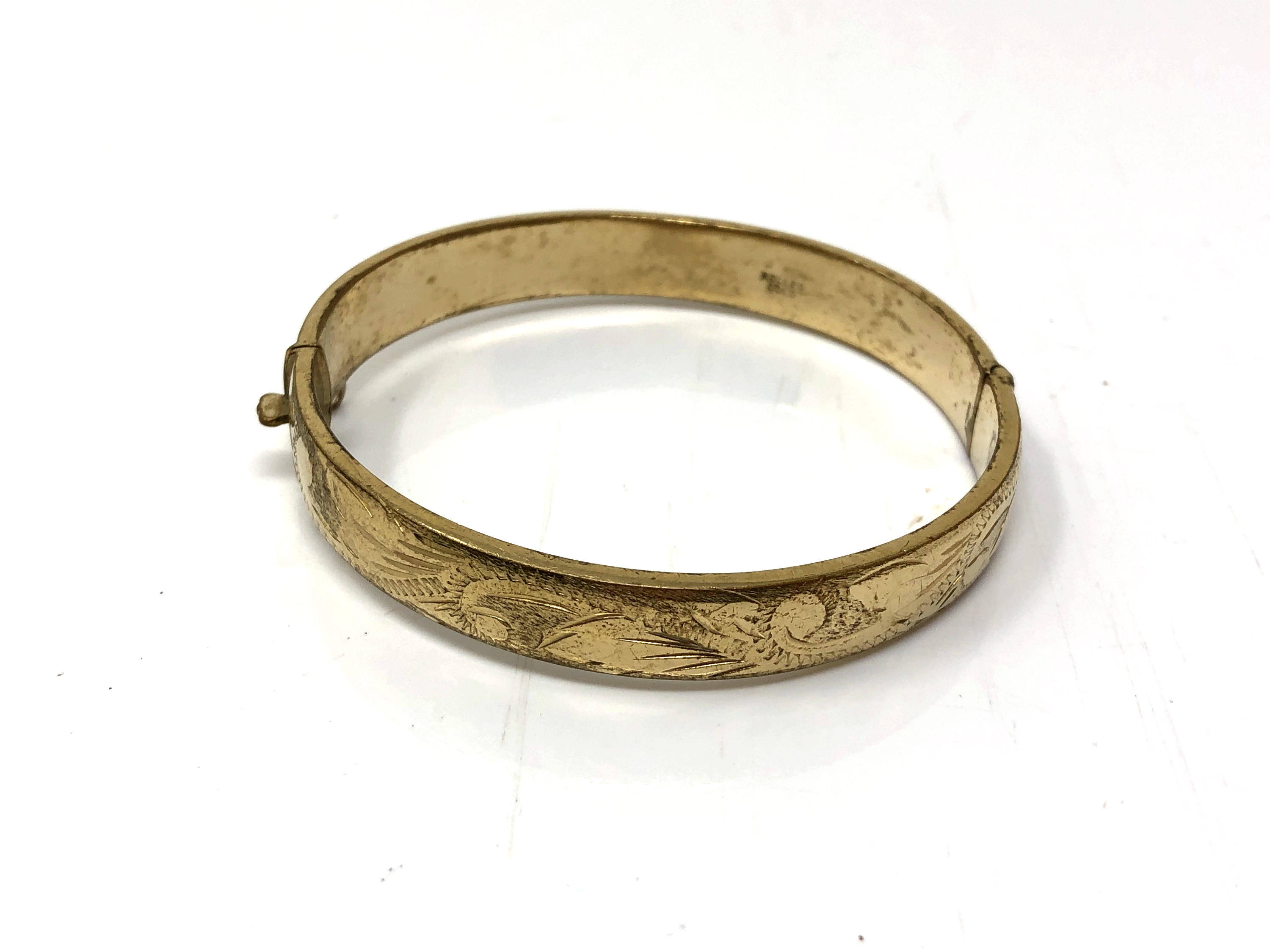 A rolled gold vintage bangle