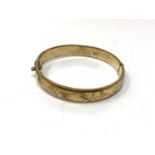 A rolled gold vintage bangle