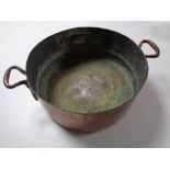 A 19th century copper cooking pot