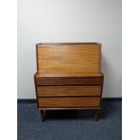 A mid 20th century teak fall front bureau fitted three drawers beneath