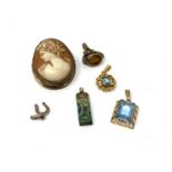 An antique cameo brooch together with pendants,