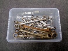 A plastic tub containing a large quantity of engineering spanners