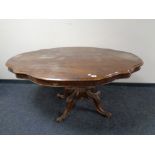 A 19th century shaped walnut dining table