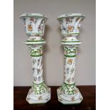 A pair of Capodimonte pottery jardinieres on stands,