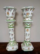 A pair of Capodimonte pottery jardinieres on stands,