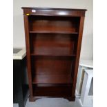 A reproduction inlaid mahogany open bookcase