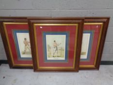 A set of three framed boxing prints