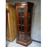 A contemporary hardwood glazed display cabinet