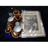 A tray containing Bondware gilt coffee china, miniature Staffordshire commemorative mug,