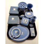 A tray containing a large quantity of boxed and unboxed Wedgwood blue and white jasperware