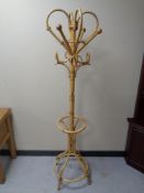 A wicker hat and coat stand