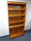 A set of contemporary yew wood veneered open bookshelves