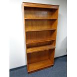 A set of contemporary yew wood veneered open bookshelves