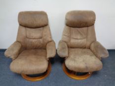 A pair of contemporary relaxer armchairs in brown suede upholstery