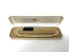 A Lotus simulated pearl necklace in original box