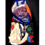 A box containing a quantity of flags on poles together with a quantity of knitted goods,
