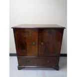 A reproduction inlaid mahogany TV cabinet