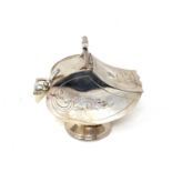 A silver plated sugar scuttle with scoop