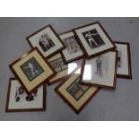 A group of approximately ten framed boxing prints