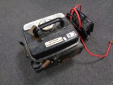 A Medusa T950 compact generator together with an AC adapter