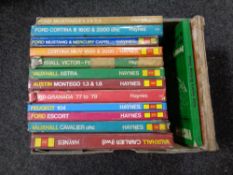 A box containing a quantity of vintage Haynes car manuals