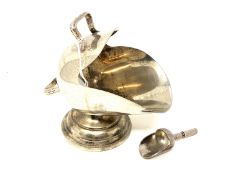 A silver plated sugar scuttle with shovel