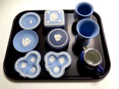 A tray containing approximately ten pieces of Wedgwood blue and white Jasperware including dishes,