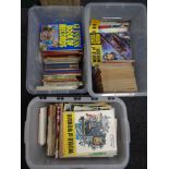 Three boxes containing a quantity of comics and volumes including Look and Learn, World of Wonder,