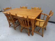 A contemporary pine farmhouse dining table fitted a drawer together with a set of six pine kitchen