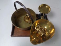 An Edwardian oak twin-handled serving tray containing a set of vintage kitchen scales with brass