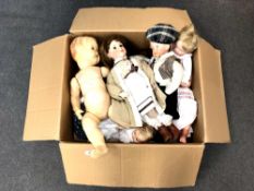 A box containing assorted vintage and later dolls including several stamped Made in England,