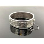 An engraved silver bangle CONDITION REPORT: 29.